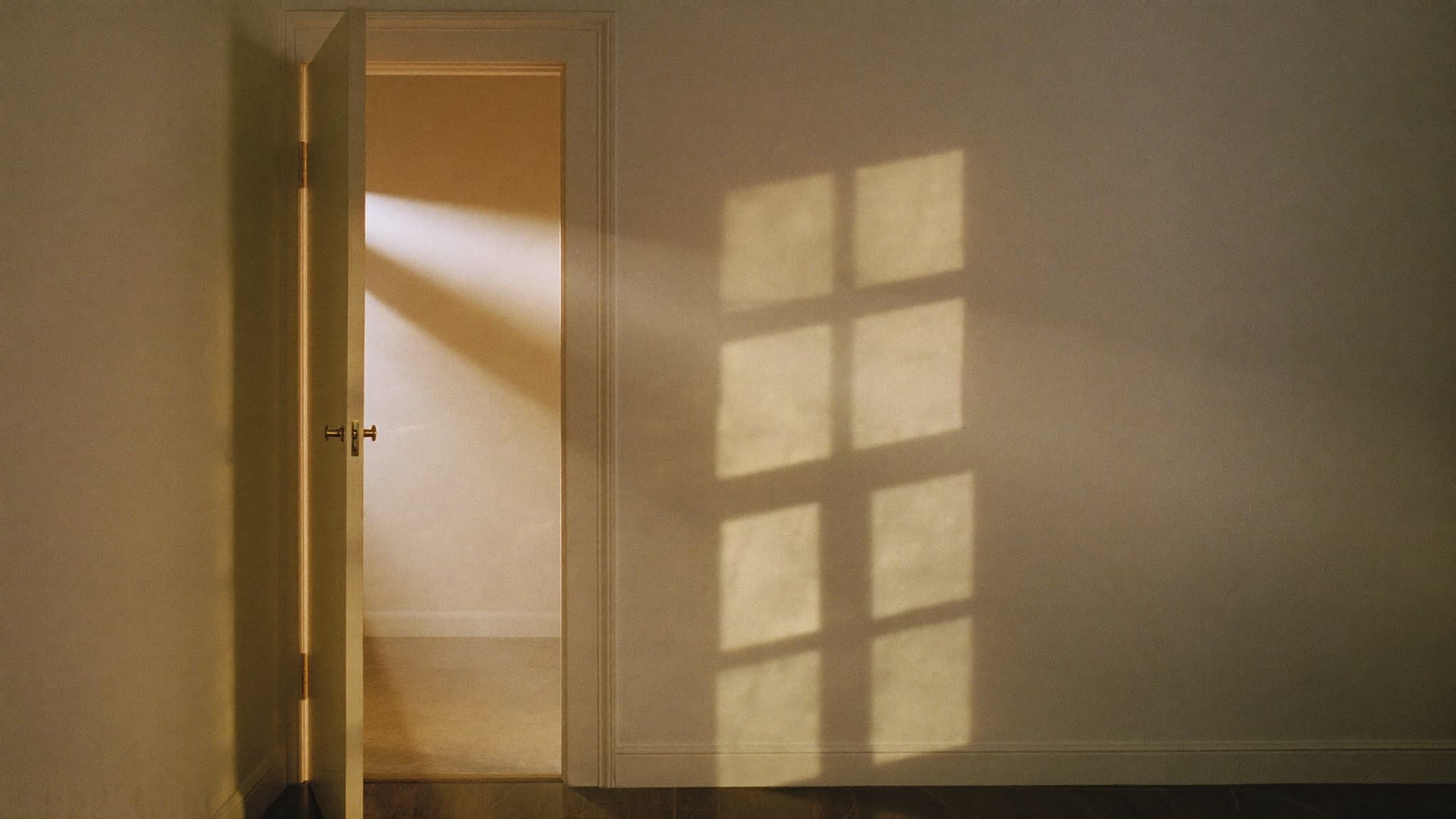 Warm light through an open doorway \u2014 the trust a law firm's marketing has to carry